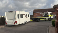 The caravan from the rear, hitched up to a lorry