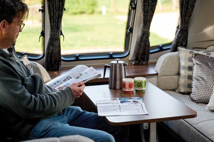 Peter reading a copy of Practical Caravan