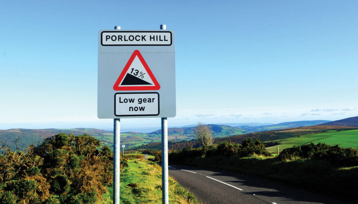 A sign at Porlock Hill saying "Low gear now"