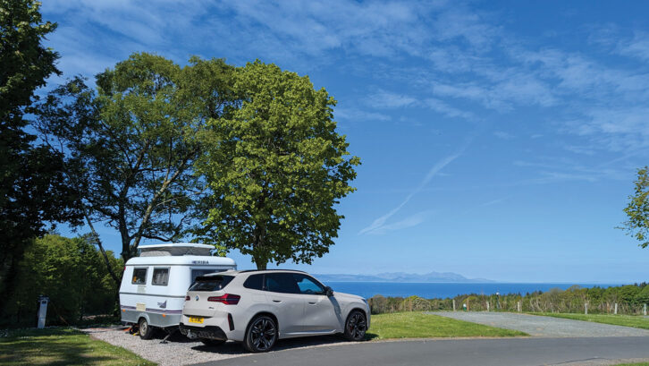 Lottie's Eriba and car parked up by the coast