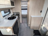 Looking down the van towards the kitchen and rear island bed