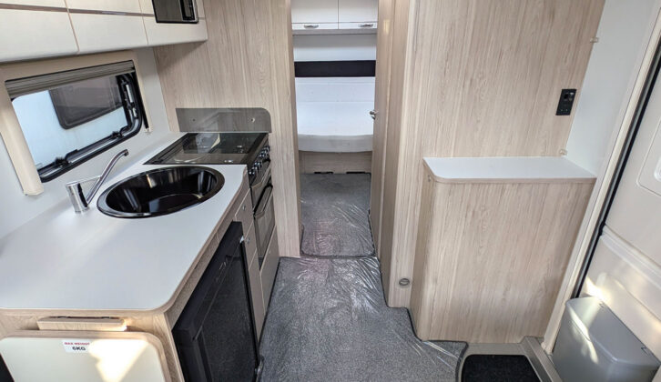 Looking down the van towards the kitchen and rear island bed