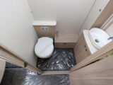 The toilet and washbasin in the washroom
