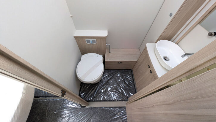 The toilet and washbasin in the washroom