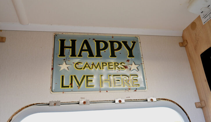 A sign saying "Happy campers live here"
