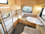 The dinette and fixed bunk beds in the Xplore