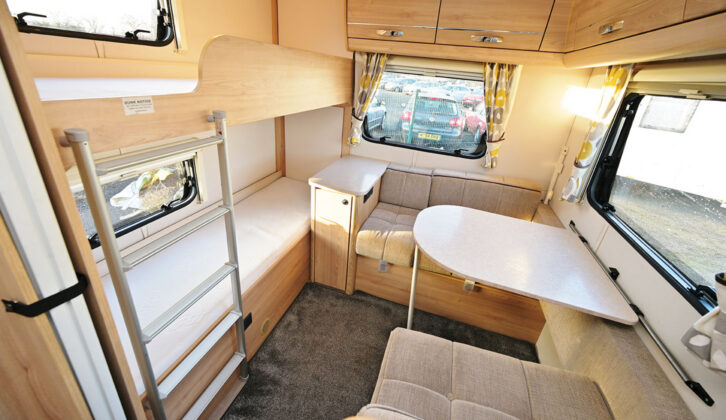 The dinette and fixed bunk beds in the Xplore