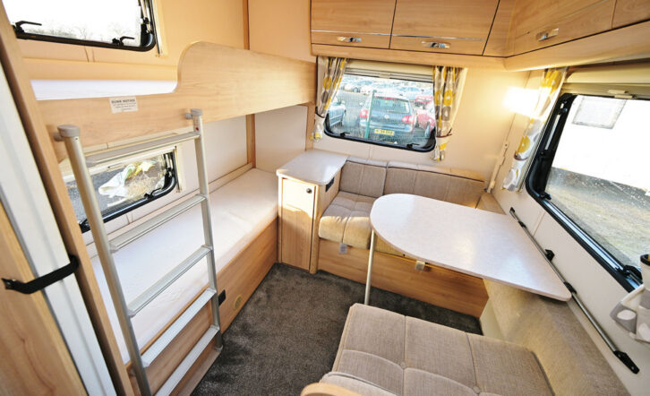 The dinette and fixed bunk beds in the Xplore