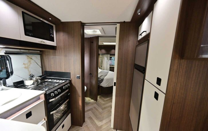 Looking down the kitchen towards the bed