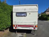 The caravan from the rear on the street