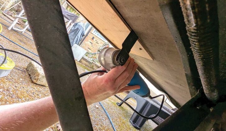 Pinning the patch in place and cutting it flush with the edges