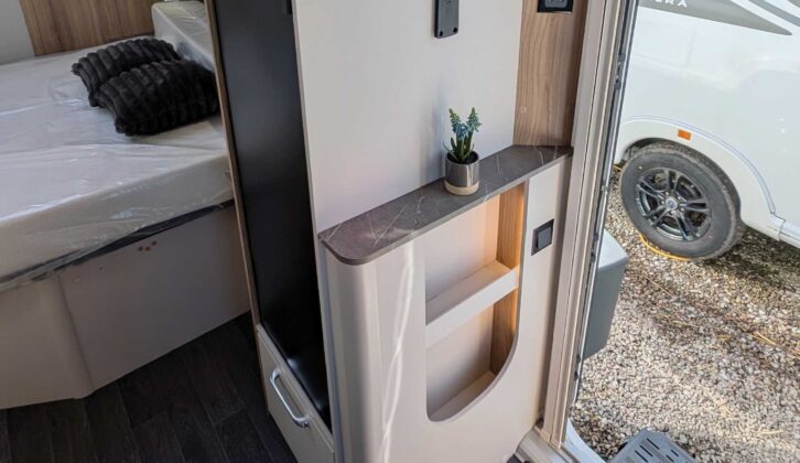 The shelving unit by the door