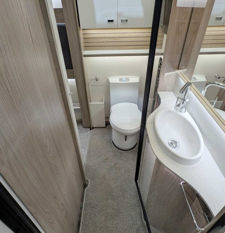 The Conqueror's washroom includes a large mirror and a ladder radiator