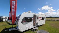An Elddis flag by an Avante Apex 550