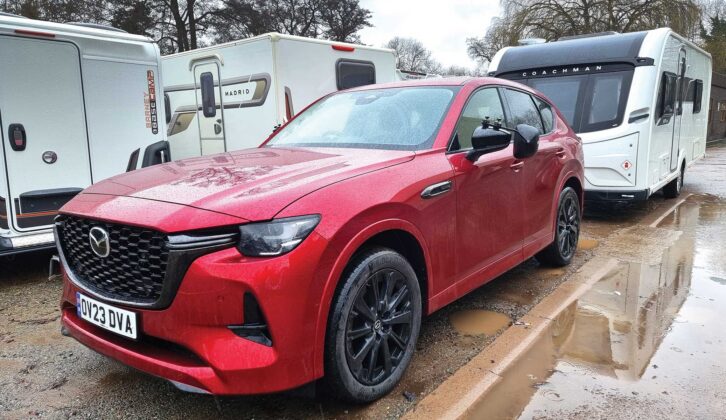 The Mazda CX-60 hitched up to a car