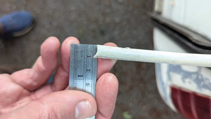 Using a ruler to show the Herzim trim is 12mm