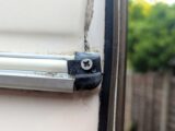 One of the new stainless steel screws