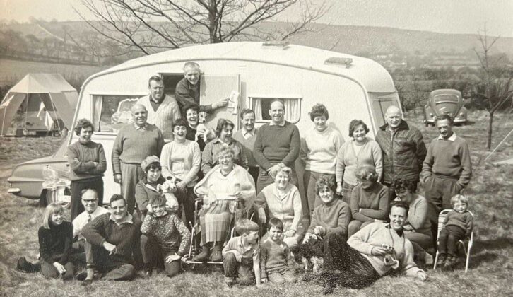 A group photo taken outside a caravan at an Easter Meet, 1968