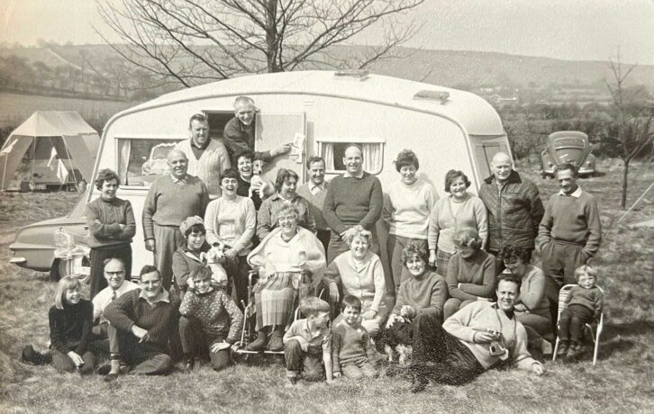 A group photo taken outside a caravan at an Easter Meet, 1968