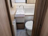 The washbasin and toilet in the washroom