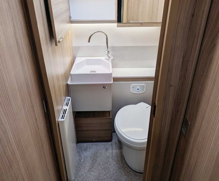 The washbasin and toilet in the washroom