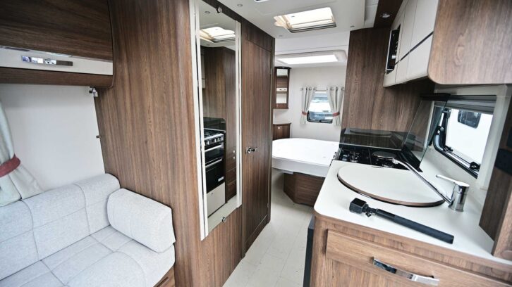 The dark-wood veneer against the lighter fabrics in the van