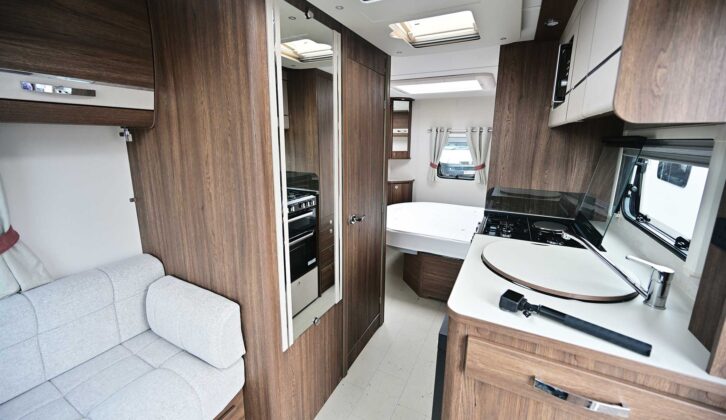 The dark-wood veneer against the lighter fabrics in the van