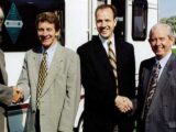 Roger Crafts (pictured second from the left) shaking hands