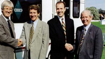 Roger Crafts (pictured second from the left) shaking hands