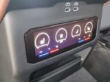 The seat controls for the back seats