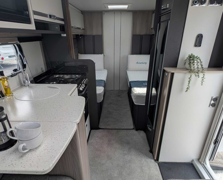 Looking towards the fixed single beds in the Conqueror 565