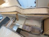 The bed lifted up to provide access to the small lockers underneath