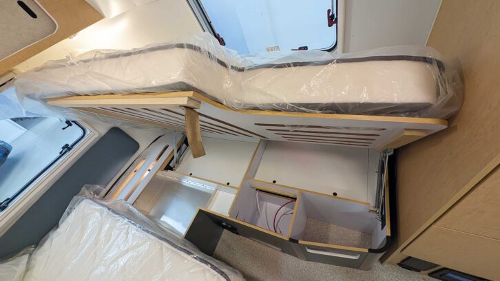 The bed lifted up to provide access to the small lockers underneath