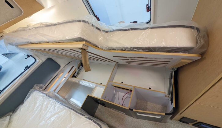 The bed lifted up to provide access to the small lockers underneath