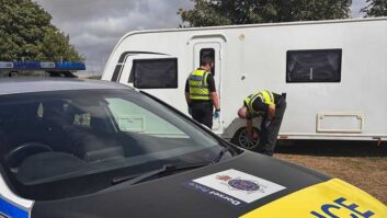 Police with the retrieved caravan