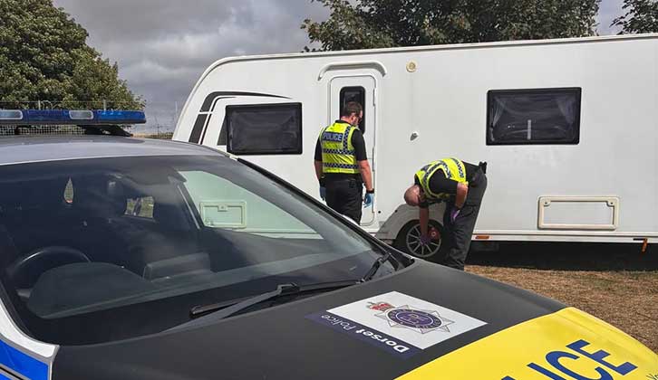 Police with the retrieved caravan