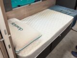 One of the fixed single beds in the Conqueror 565