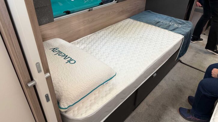 One of the fixed single beds in the Conqueror 565